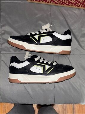 Black and White Low-Top Vans Sneakers with Gum Sole and Lime Accent